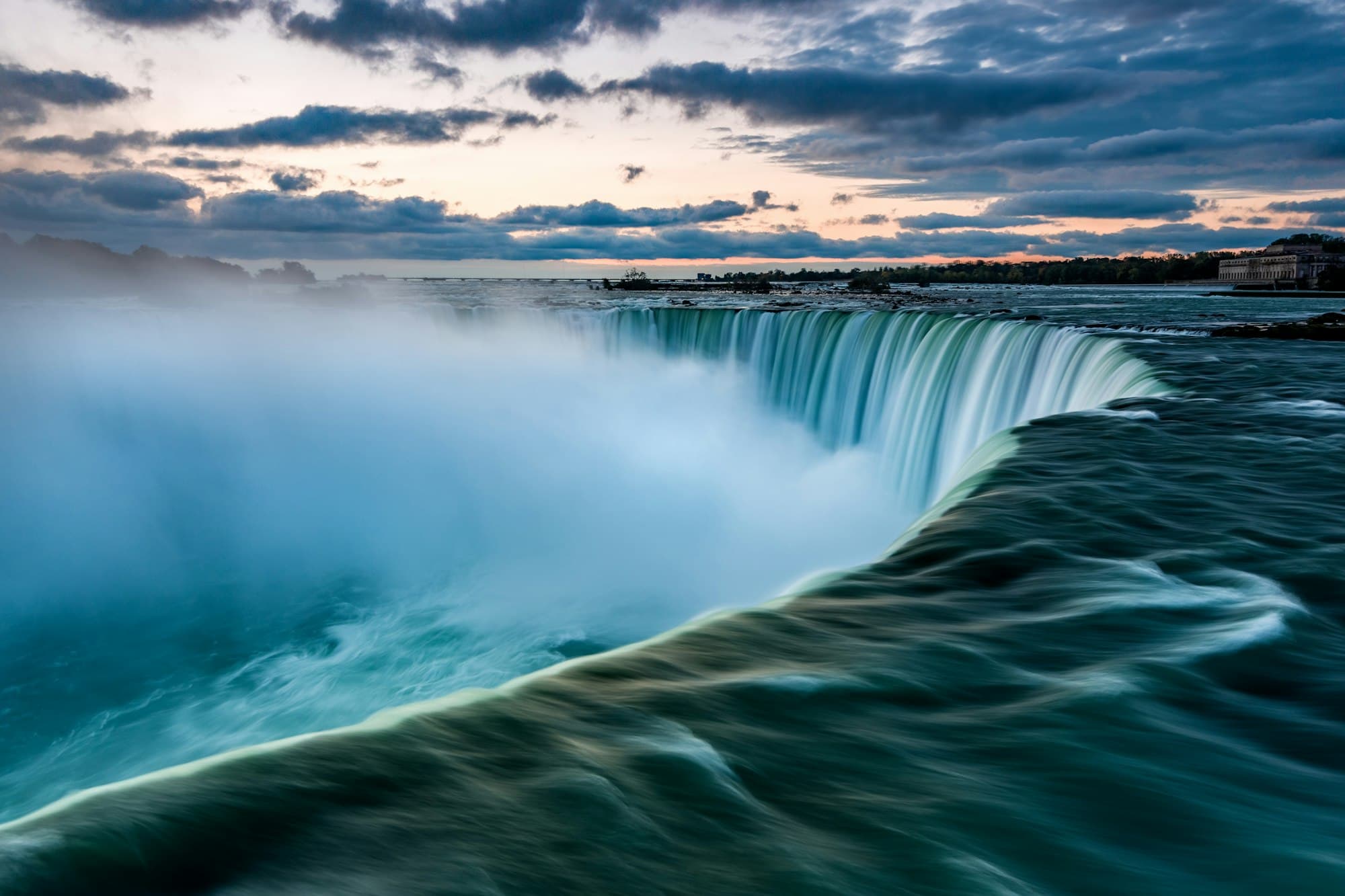 Horseshoe Falls at dusk, mist rising over the brink