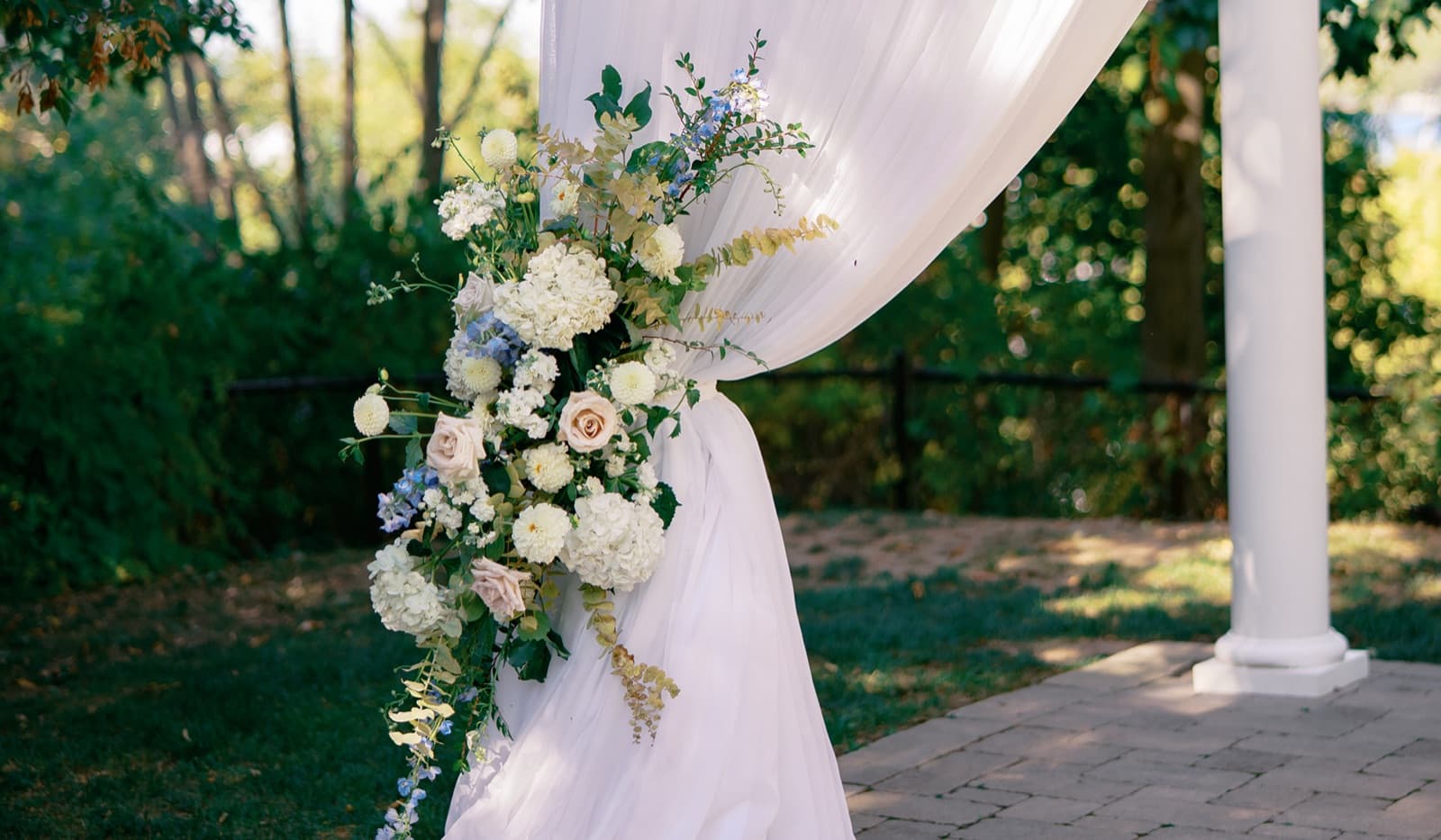 White drapery and blue-and-white florals in the garden